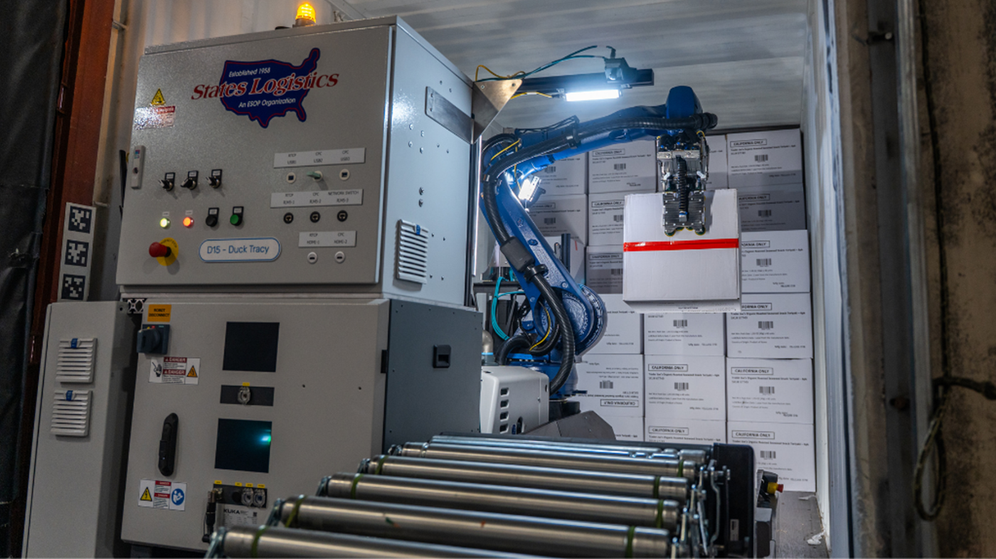 The KUKA robot unload cases from a trailer at States Logistics